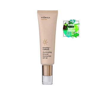 Cremă hidratantă și iluminantă SPF 50 Ginseng + Cafeină, tub bej cu detalii aurii.