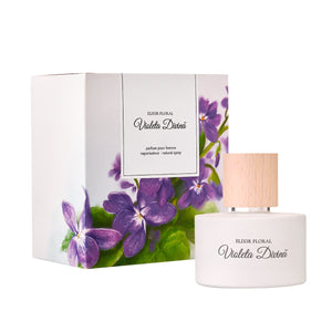 Parfum "Elixir Floral Violeta Divină" în sticlă albă cu capac din lemn, ambalaj floral violet.