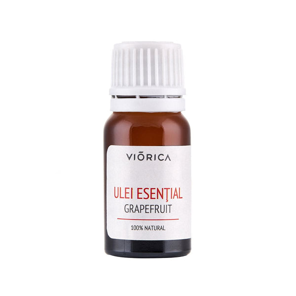 Ulei esențial de grapefruit în sticlă maro cu etichetă albă și capac alb.